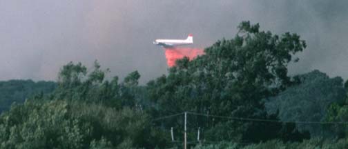 DC-6 makes a retardant drop on the Azalea Fire