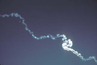 Delta-II exhaust trail is contorted by winds aloft on December 7, 2001