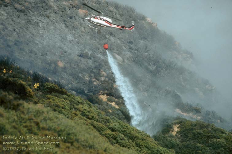 Bell 212 N508EH drops water on the Camino Fire