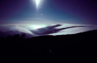 Clouds stream through passes in the Santa Ynex Mountains